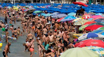 People cool off at the beach during the heat wave in the south-eastern coastal town of Benidorm, Spain. (Reuters file image)