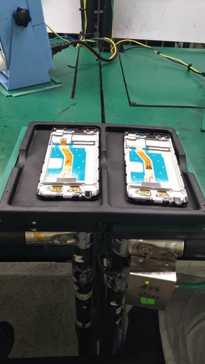 Phone frame placed around PCB with phone components after rigorous testing for proper functioning and dust