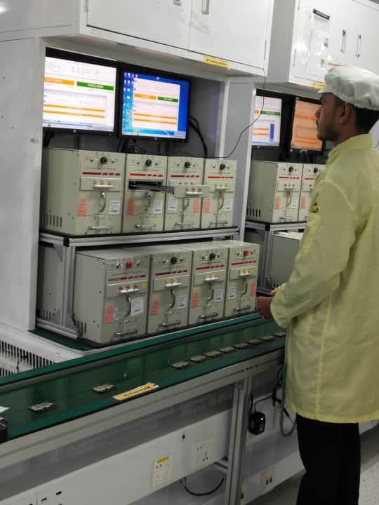 PCBs being inspected after the components are mounted 