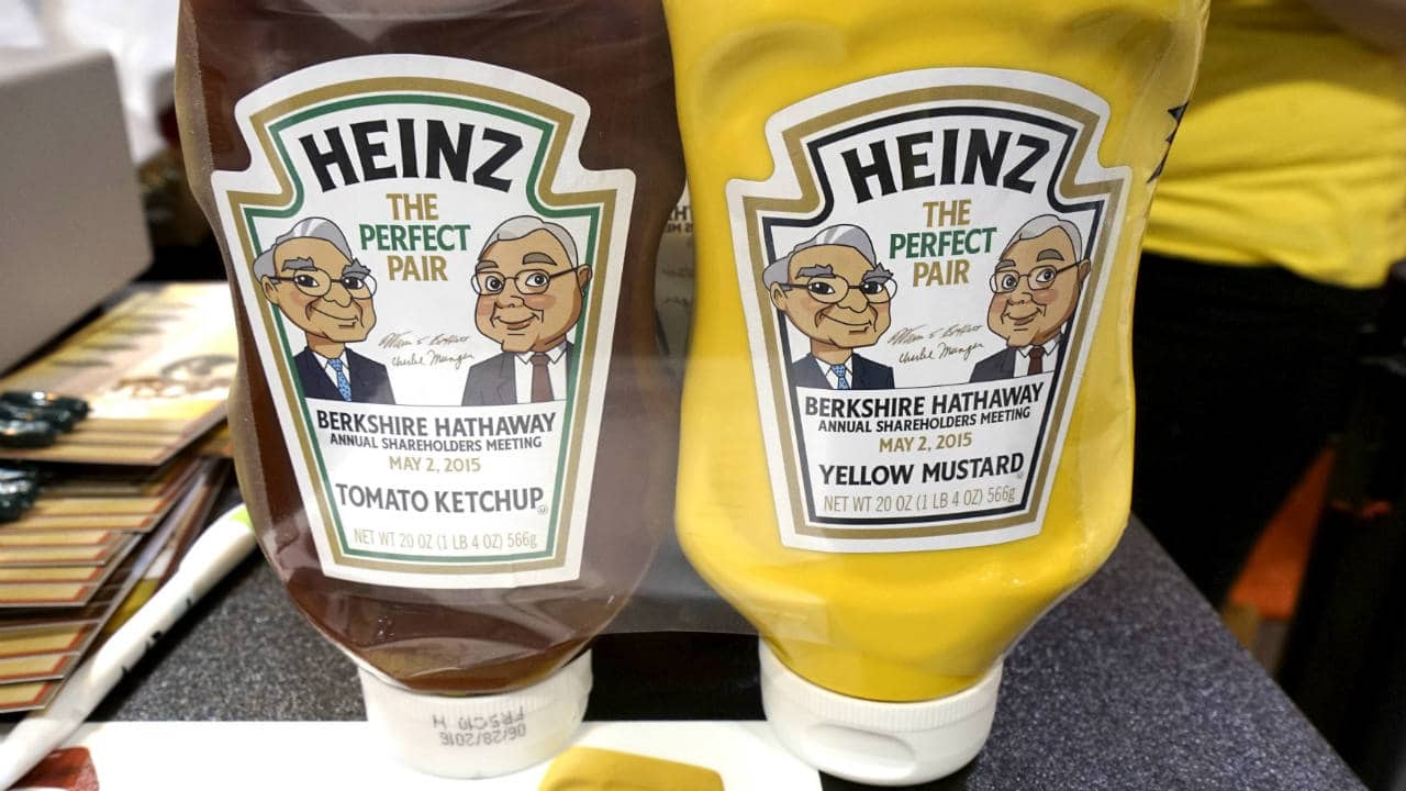 In December of 1962, Warren Buffett (then 32), was gaining notoriety as an investor in Omaha, this was also when he first began buying stock in Berkshire Hathaway. By mid-1965, he had bought enough shares to take control of the company. (Pictured here are caricatures of Buffet and Berkshire Hathaway Vice-Chairman Charlie Munger on Heinz bottles. Kraft Heinz is backed by Berkshire Hathaway and 3G Capital)