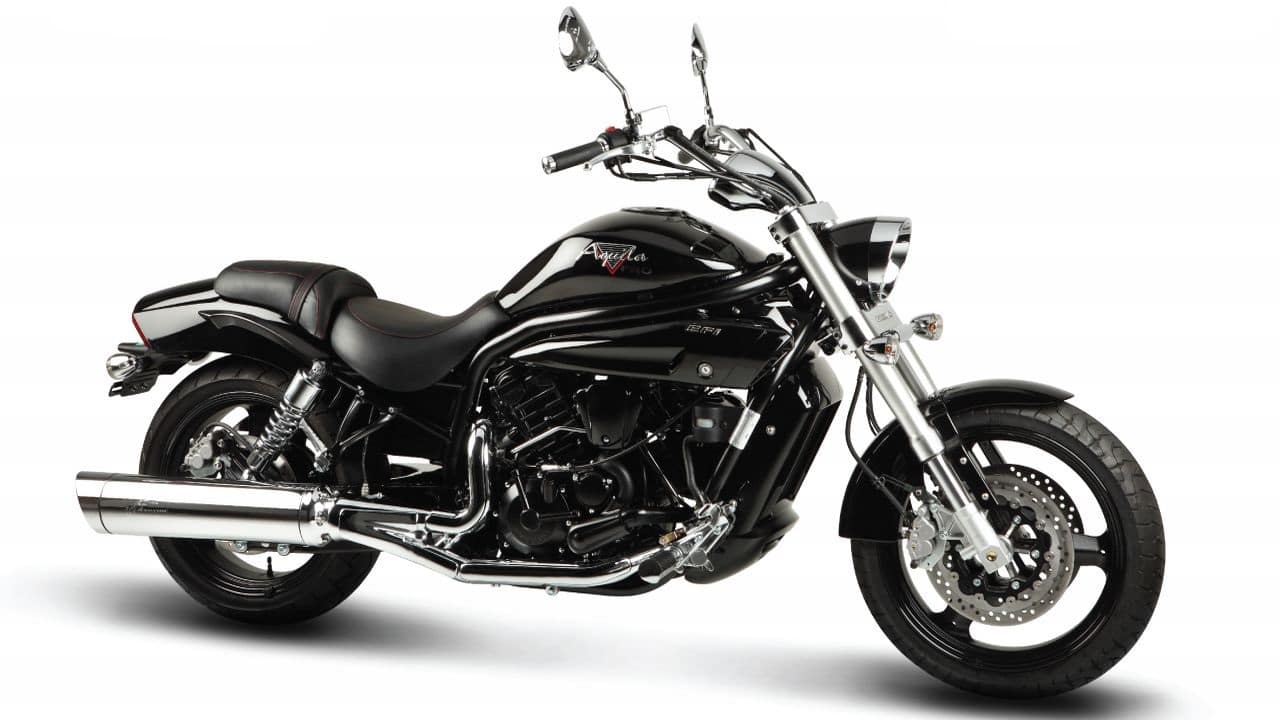 Hyosung GV650 Aquila | Rs 5.35 lakh (ex-showroom) | The cruiser on this list is the Hyosung GV650. You get a 647cc V-Twin making 74 Bhp at 9,000 rpm and 62 Nm of torque at 7,500 rpm mated to a 5-speed gearbox. Suspension comes from a 43 mm upside down forks and rear double shock absorbers. Dual channel ABS comes as an optional extra. (Image source: Motoroyale) Hyosung GV650 Aquila | Rs 5.35 lakh (ex-showroom) | The cruiser on this list is the Hyosung GV650. You get a 647cc V-Twin making 74 Bhp at 9,000 rpm and 62 Nm of torque at 7,500 rpm mated to a 5-speed gearbox. Suspension comes from a 43 mm upside down forks and rear double shock absorbers. Dual channel ABS comes as an optional extra. (Image source: Motoroyale)
