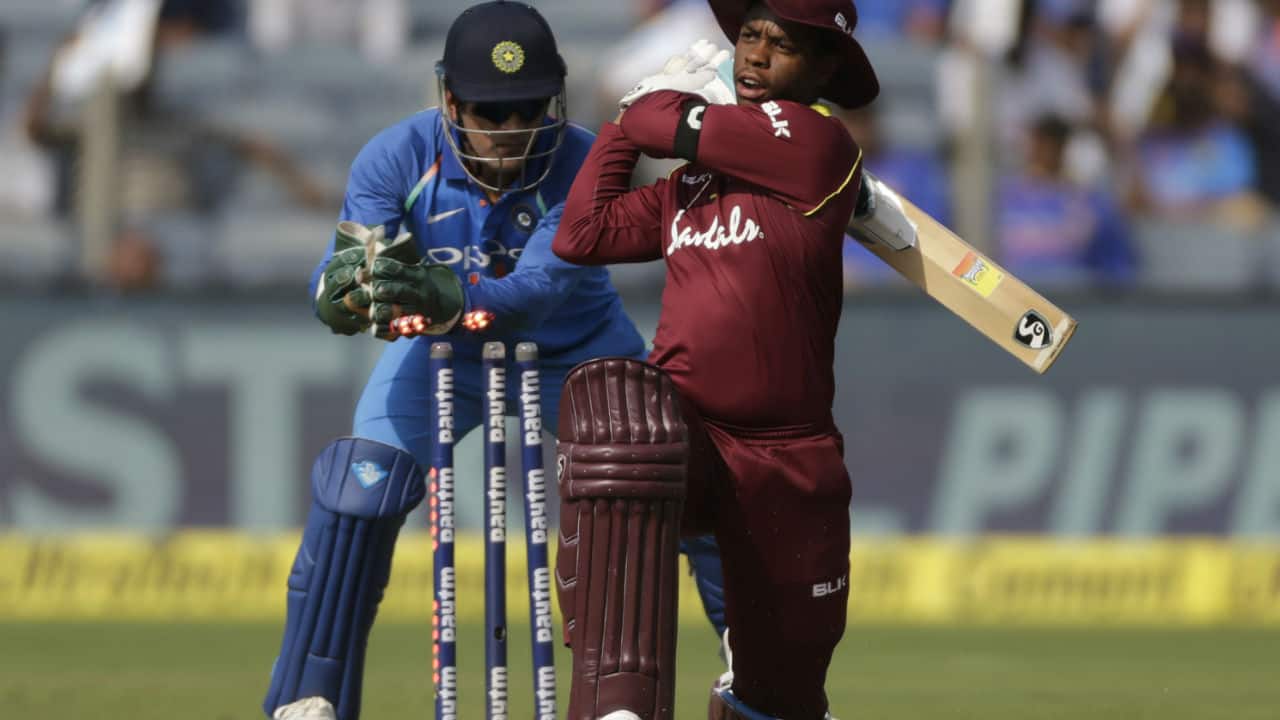 Just when it looked like Hetmyer would play yet another brisk innings the Guyana batsman was dismissed by Kuldeep Yadav thanks to brilliant piece of stumping by Dhoni. (Image: AP) Just when it looked like Hetmyer would play yet another brisk innings the Guyana batsman was dismissed by Kuldeep Yadav thanks to brilliant piece of stumping by Dhoni. (Image: AP)
