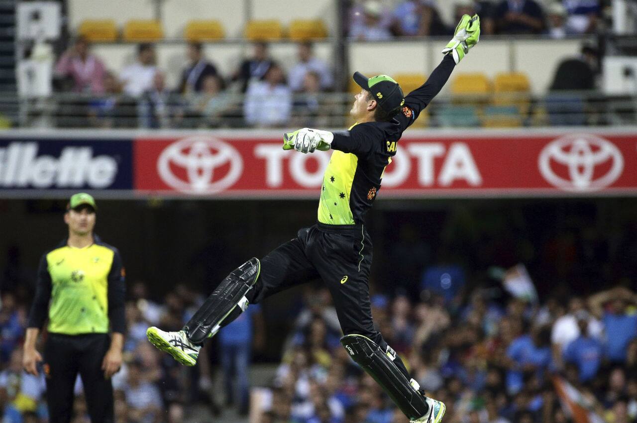 As Australian fast bowlers peppered India batsmen with short balls Aussie wicket-keeper Alex Carey was kept busy behind the wickets. (Image: AP)