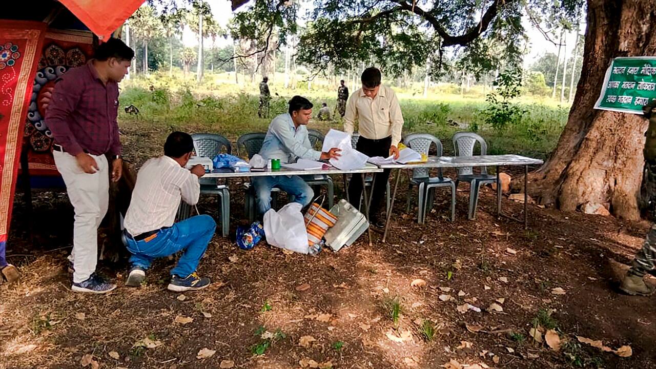 A polling station set up under a tree during the first phase of Assembly elections in Sukma (Image: PTI).