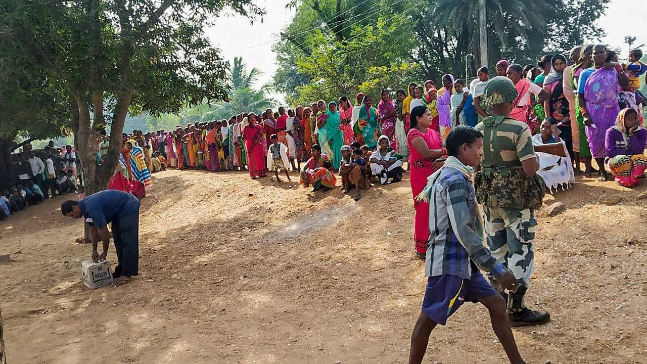 A serpentine queue outside a polling station in Solana, Hamirgarh. (Image: PTI)