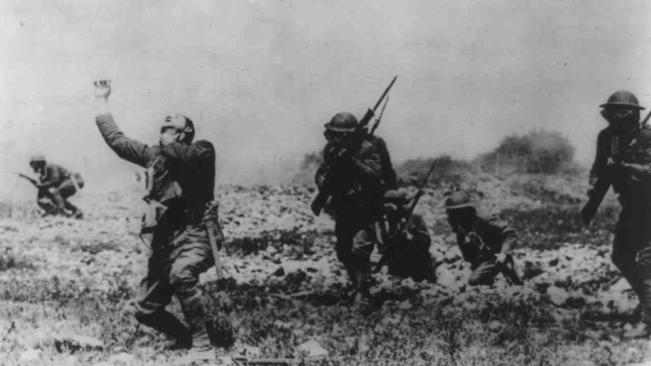 Pictured: American soldiers react to a gas attack, likely used for training purposes. (Image: Reuters) Pictured: American soldiers react to a gas attack, likely used for training purposes. (Image: Reuters)