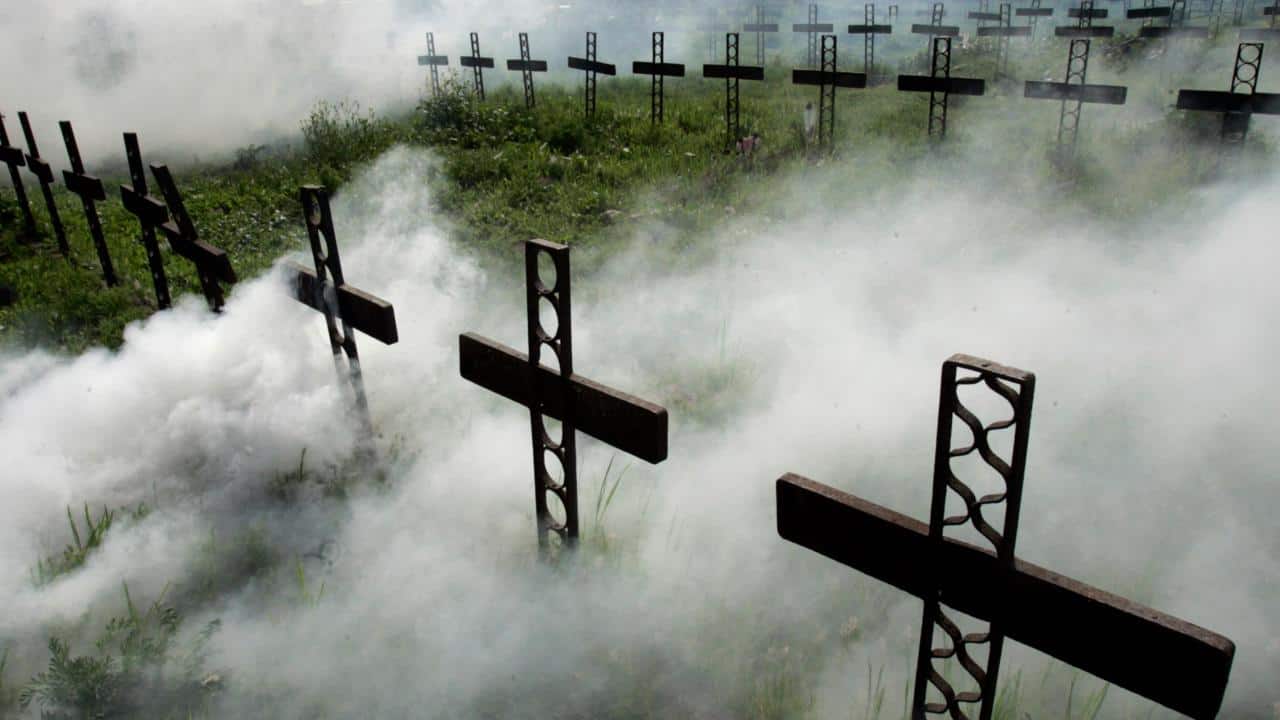 Chile | Camping at the graveyard | This is a tradition that started only around 15 years ago. A family crossed over the cemetery’s fence to celebrate New Year’s next to their father’s grave. Since then, many people celebrate New Year’s with their deceased loved ones. (Image: Reuters)