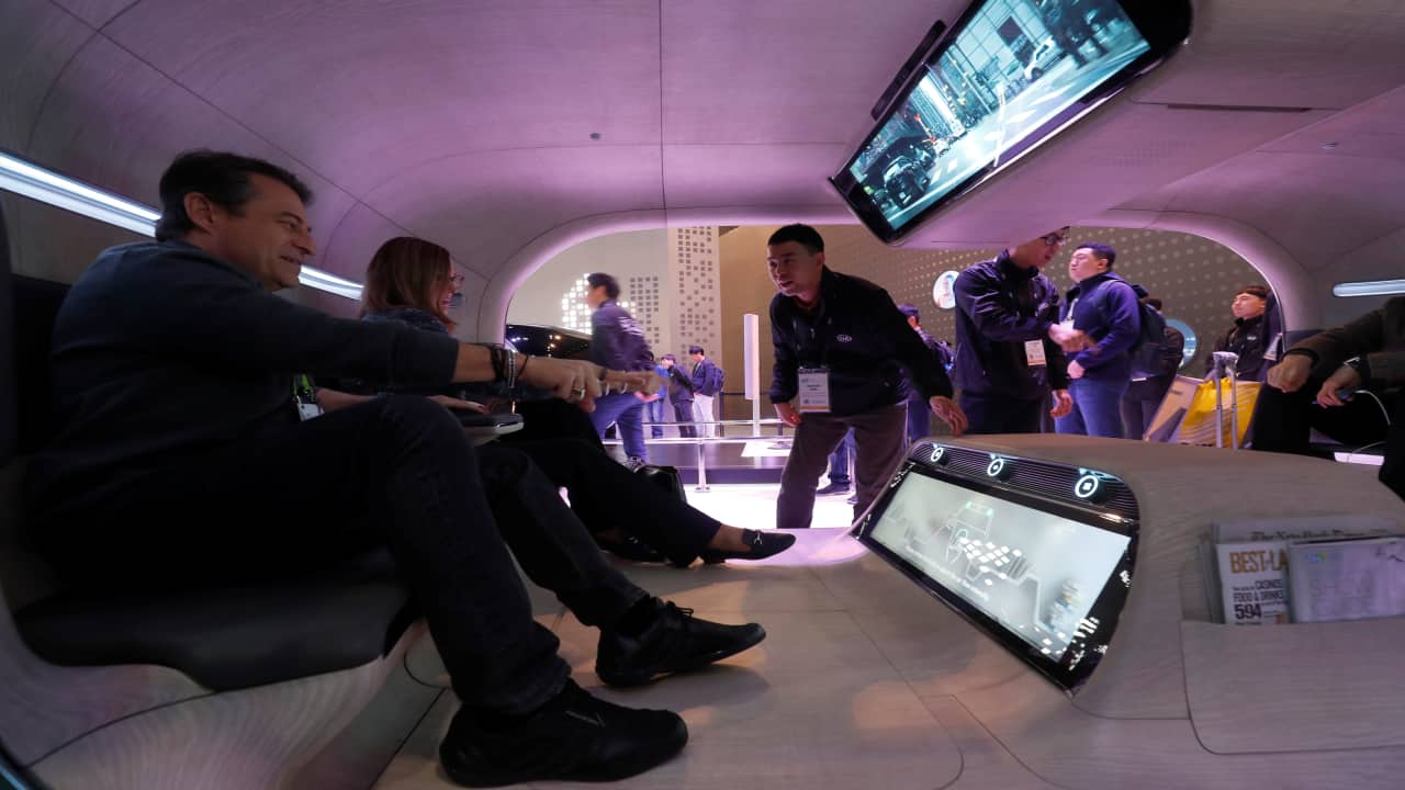 Passengers use gesture control to access functions in a mock-up of an autonomous vehicle at the Kia booth during CES 2019 at Las Vegas. (Image: Reuters)