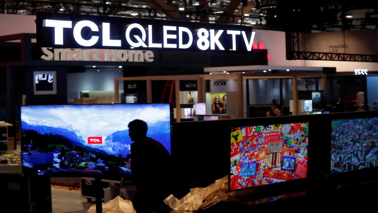 QLED 8K televisions are displayed at the TCL booth in the Las Vegas Convention Center as workers prepare for CES 2019. (Image: Reuters)