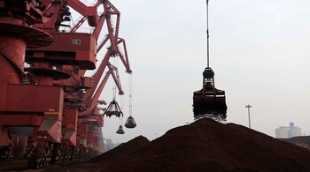 Representational Image. Iron ore being loaded onto a container ship. (Reuters)
