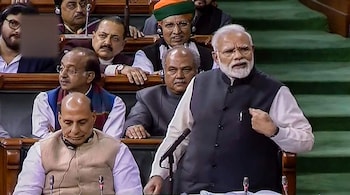 New Delhi: Prime Minister Narendra Modi addresses the Lok Sabha during the Budget Session of Parliament, in New Delhi, Thursday, Feb 7, 2019. Also seen is Home Minister Rajnath Singh. (LSTV GRAB via PTI) (PTI2_7_2019_000187B)