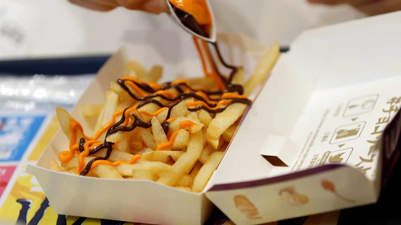 6. McDonald’s visor and a large fries | Let us hope it was a cheat day for the cab driver, because no one can resist fries. (Image: Reuters) 6. McDonald’s visor and a large fries | Let us hope it was a cheat day for the cab driver, because no one can resist fries. (Image: Reuters)