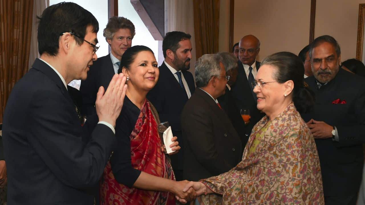 Former Congress president Sonia Gandhi shakes hands with former diplomat Meera Shankar during a meeting with the Ambassadors /High Commissioners of G-20 and neighbouring countries, in New Delhi. (PTI)