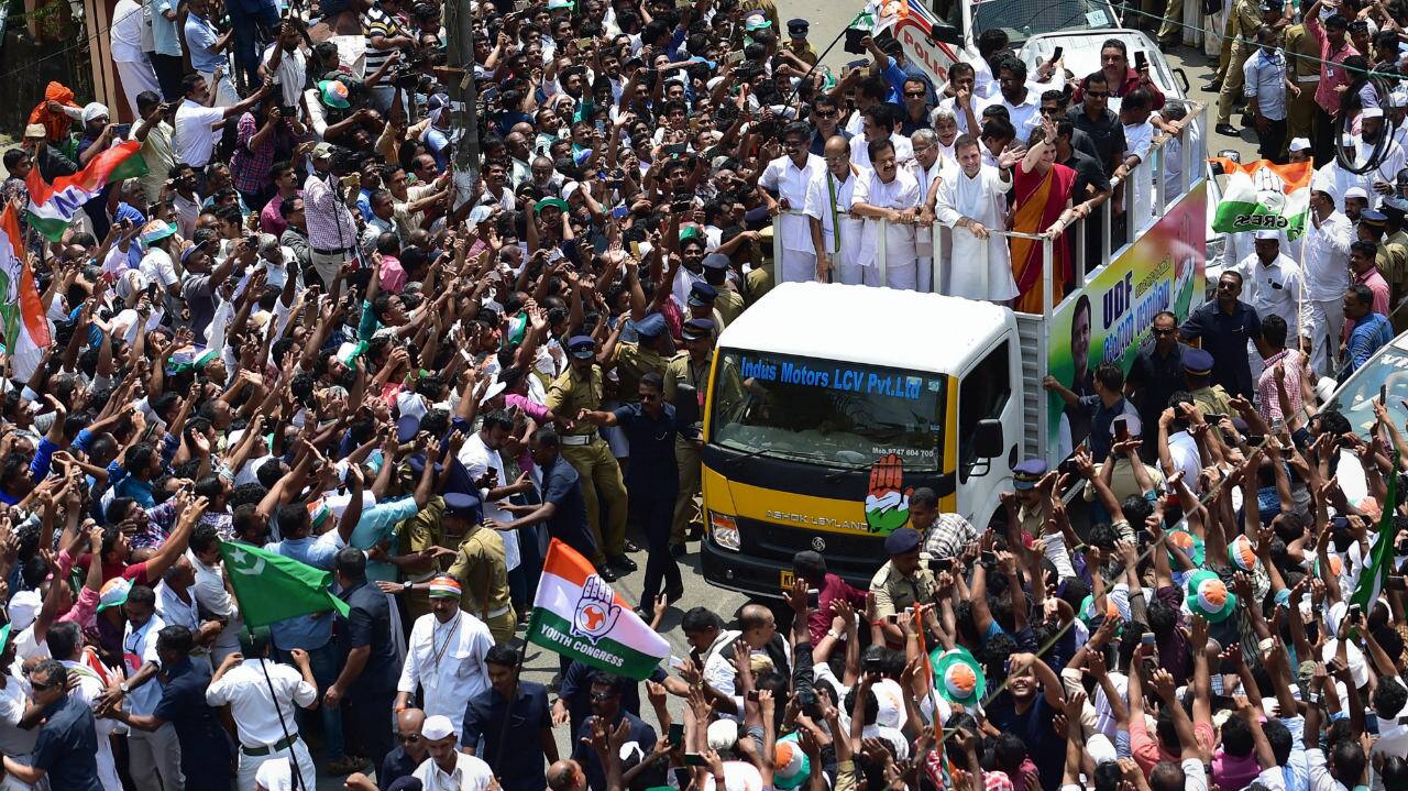 Congress President Rahul Gandhi with party General Secretary Priyanka Gandhi Vadra and other leaders wave at party supporters during a roadshow after filing his nomination papers for Lok Sabha elections, in Wayanad, Kerala. (Image: PTI)