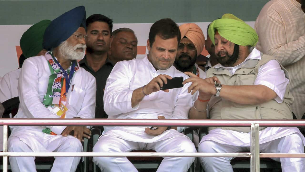 Congress leader Rahul Gandhi, Punjab Chief Minister Captain Amarinder Singh and party's candidate from Fatehgarh Sahib, Amar Singh, during a rally in Ludhiana district on May 13, 2019. (Image: PTI)