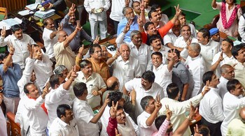 File Pic: BJP State President BS Yeddyurappa with his party MLAs show victory sign after HD Kumaraswamy lost the vote of confidence at Vidhana Soudha, in Bengaluru. (Image: PTI)