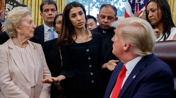 President Donald Trump listens to Nobel Peace Prize winner Nadia Murad, a Yazidi from Iraq, center, as he meets with survivors of religious persecution in the Oval Office of the White House on July 17, 2019, in Washington. (Image: AP)