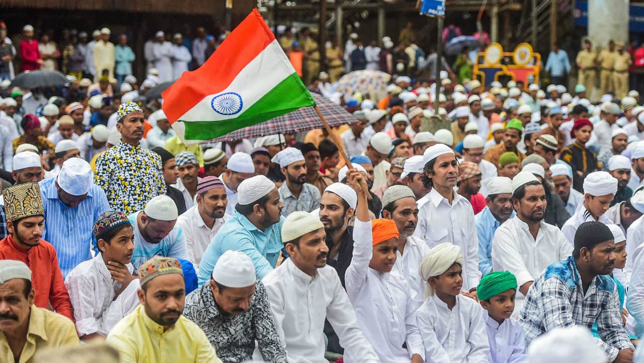 Children hold the tricolour during Eid al-Adha celebrations at Bandra station in Mumbai, Maharashtra. (Image: PTI) Children hold the tricolour during Eid al-Adha celebrations at Bandra station in Mumbai, Maharashtra. (Image: PTI)