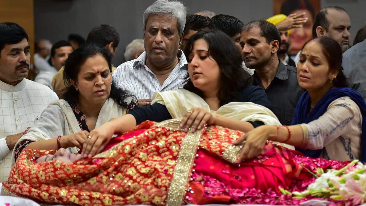 Sushma Swaraj's daughter Bansuri, and husband Swaraj Kaushal at BJP headquarters in New Delhi. (Image: PTI)