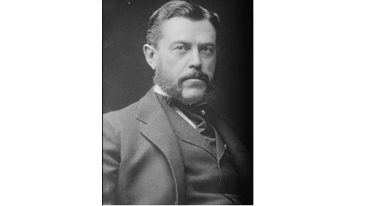 He was known for his large scale financial deals for which he got the moniker “Father of Trusts”. He consolidated several companies to form US Rubber. Several years later he merged Adams Chewing Gum , Chiclets , Dentyne and Beemans to form American Chicle. However it was for his last amalgamation that he is most well known. Who is he and what was the amalgamation?