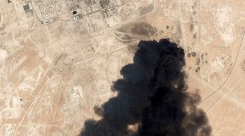 This Saturday, Sept. 14, 2019, satellite image from Planet Labs Inc. shows thick black smoke rising from Saudi Aramco's Abqaiq oil processing facility in Buqyaq, Saudi Arabia. Yemen's Houthi rebels launched drone attacks on the world's largest oil processing facility in Saudi Arabia and a major oil field Saturday, sparking huge fires and halting about half of the supplies from the world's largest exporter of oil. (Planet Labs Inc via AP)