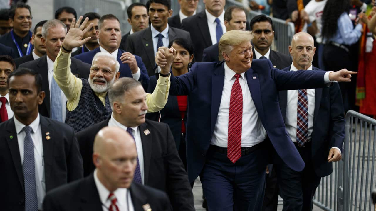PM Modi also invited Trump to India along with his family. In this picture, Modi and Trump are seen taking a lap of the NRG stadium after their addresses (Image: AP)