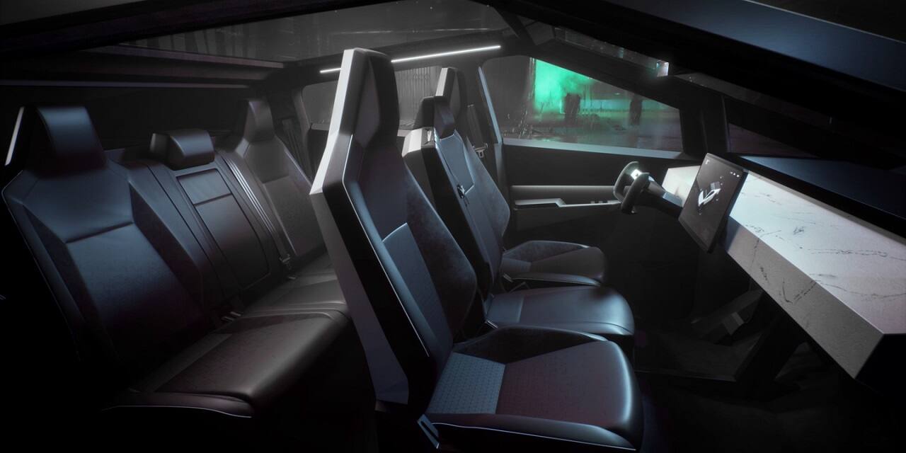 The truck seats six people with additional storage under the second-row seats. It has a 17” touchscreen with a customised user interface. It has a ground clearance of over 406 mm. (Image Source: Tesla.com)