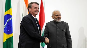 Brazil's President Jair Bolsonaro shaking hands with India's Prime Minister Narendra Modi during a summit on June 28, 2019. (Image Reuters)
