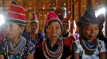 Bru tribal women attend a prayer meeting inside a temple at Naisingpara refugee camp in the northeastern state of Tripura, Agartala (Image: Reuters)