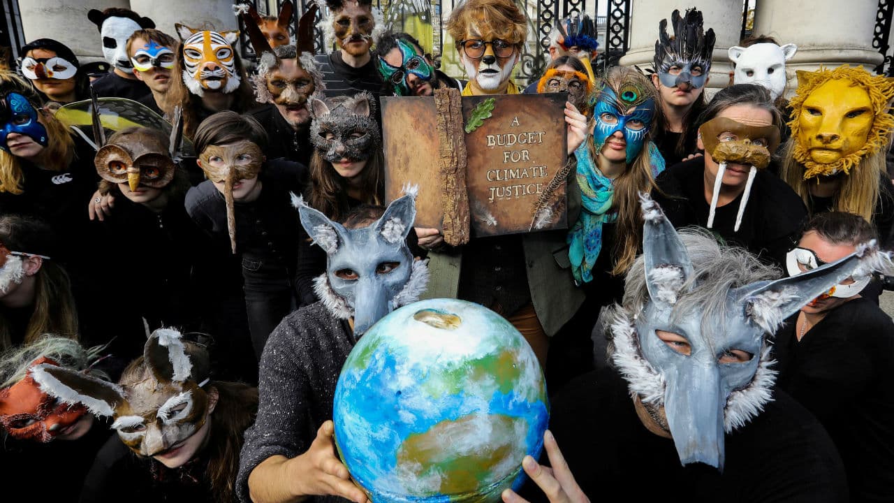 Extinction Rebellion protestors pose outside Government Buildings on Budget day in Dublin, Ireland on October 8, 2019. (Image: Reuters/Lorraine O'Sullivan)