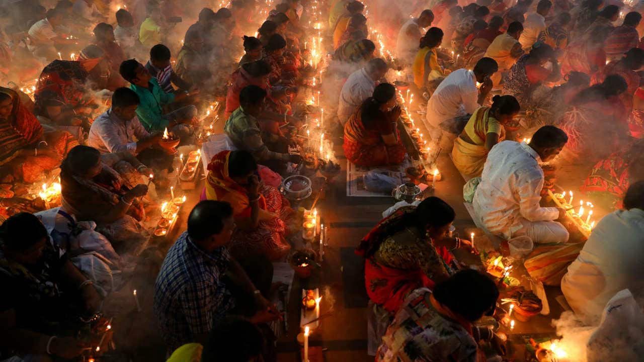 Hindu devotees sit together on the floor of a temple to observe Rakher Upabash, in Narayangonj near Dhaka, Bangladesh on November 5, 2019. (Reuters/Mohammad Ponir Hossain)