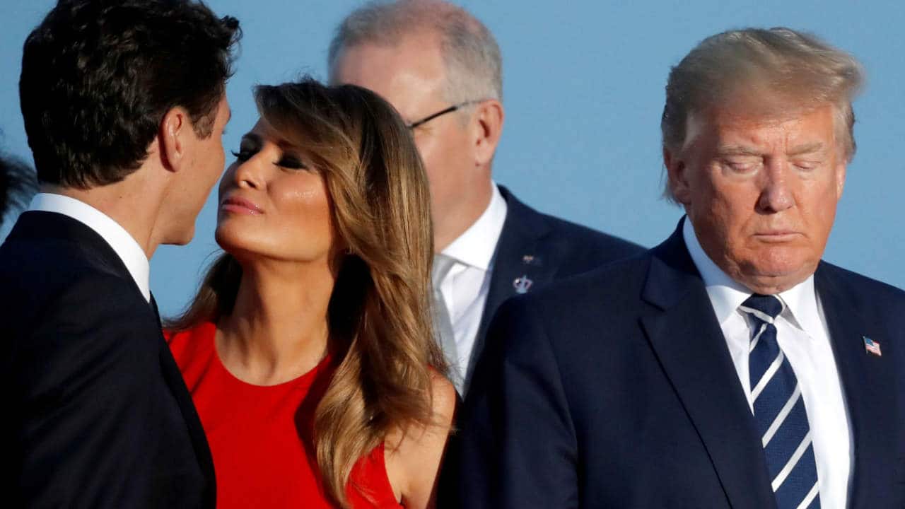 First lady Melania Trump kisses Canada's Prime Minister Justin Trudeau next to US President Donald Trump during a family photo session with invited guests at the G7 summit in Biarritz, France on August 25, 2019. (Image: Reuters/Carlos Barria)