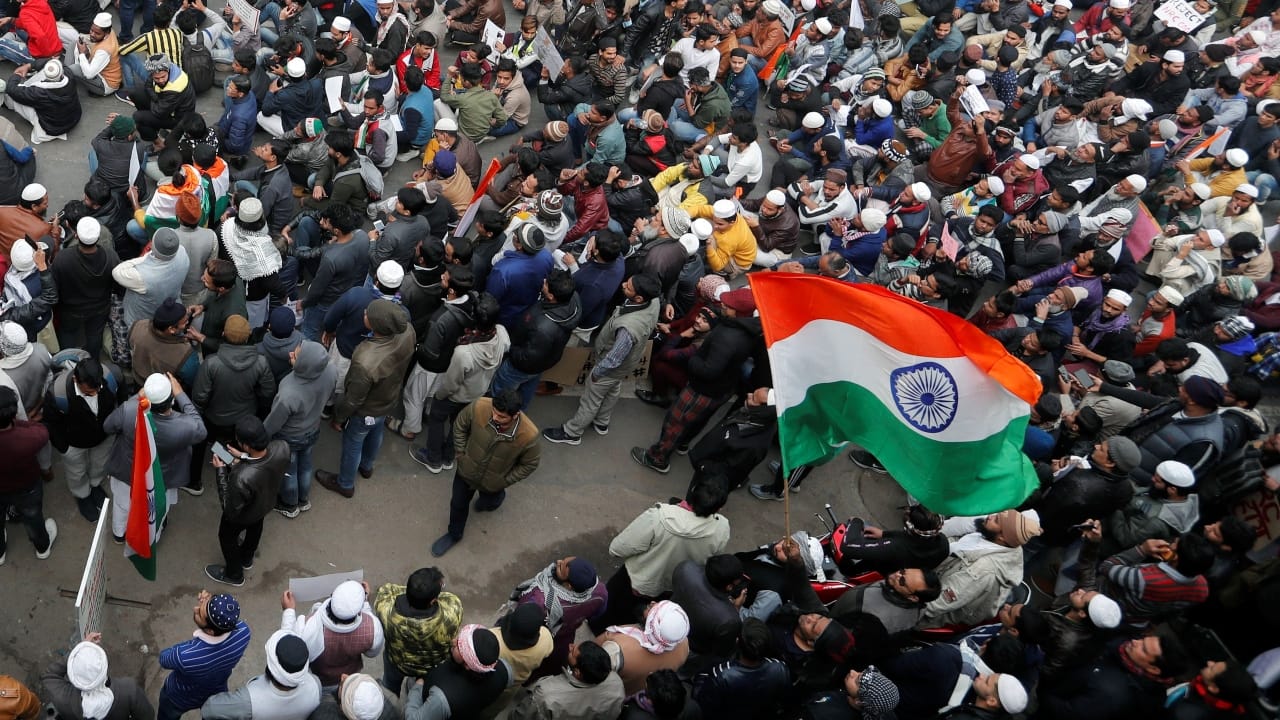 Demonstrators gather in the national capital to protest against the Citizenship Amendment Act (CAA). The proposed legislation gives citizenship to non-Muslim immigrants who faced religious persecution in Pakistan, Bangladesh and Afghanistan and have come to India before December 31. (Image: Reuters) 