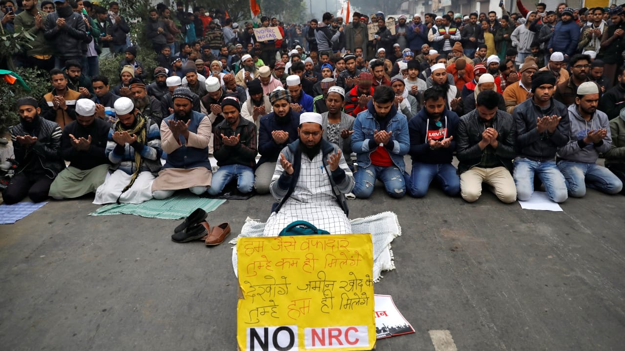 Members of the Muslim community are seen offering prayers during the protest against CAA in Delhi. (Image: Reuters)