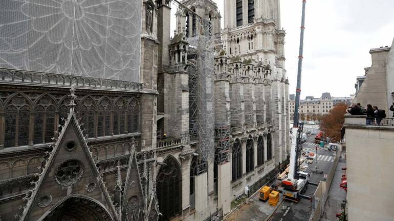 New Golden Rooster Fitted To Spire Of Paris' Notre Dame Cathedral