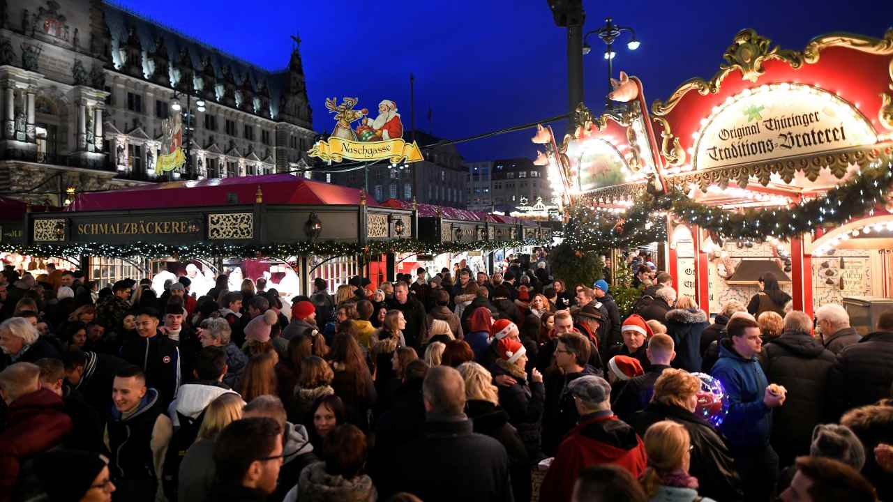 People visit a Christmas market in Hamburg, Germany (Image: Reuters)