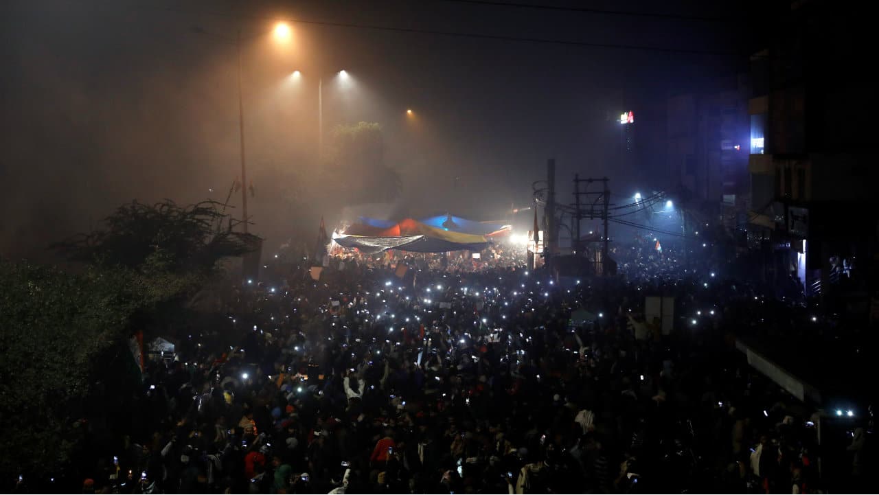 Demonstrators hold up phones with their flashlights on as they celebrate New Year during a protest against the Citizenship Amendment Act in New Delhi, India. (Image: Reuters) Demonstrators hold up phones with their flashlights on as they celebrate New Year during a protest against the Citizenship Amendment Act in New Delhi, India. (Image: Reuters)