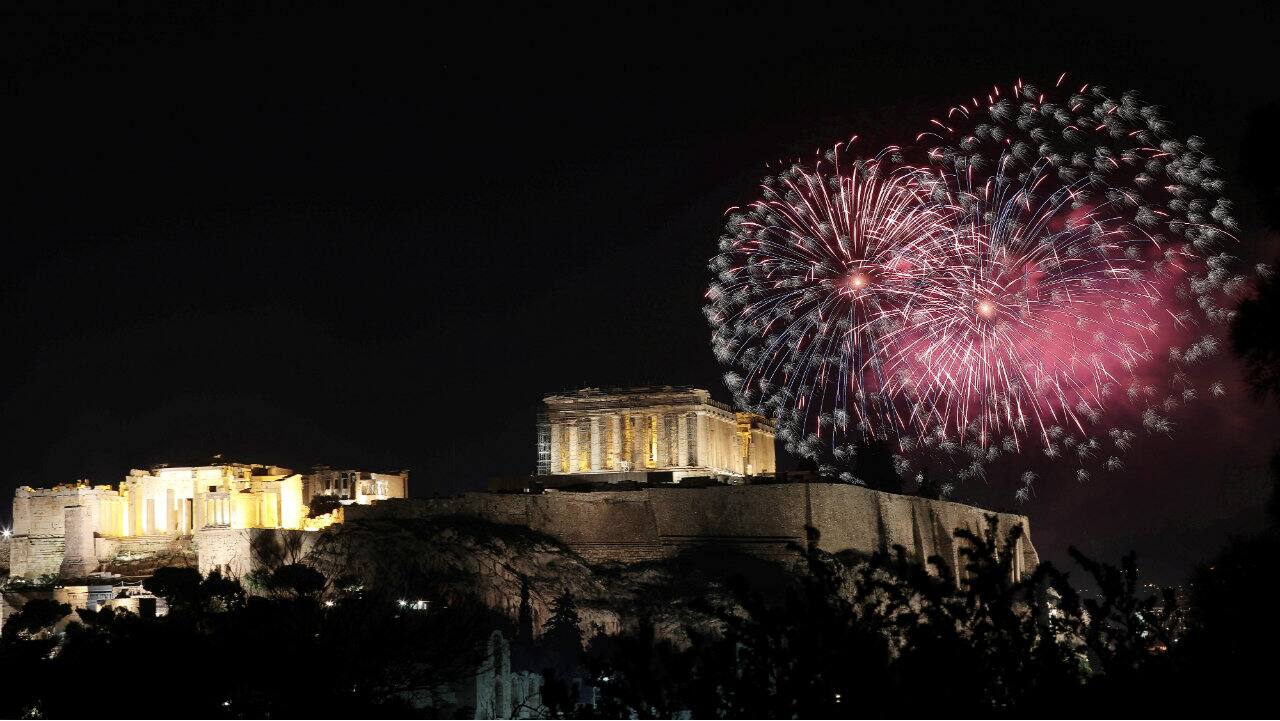 Fireworks explode over the ancient Parthenon temple atop the Acropolis hill in Athens, Greece during New Year celebrations. (Image: Reuters) Fireworks explode over the ancient Parthenon temple atop the Acropolis hill in Athens, Greece during New Year celebrations. (Image: Reuters)