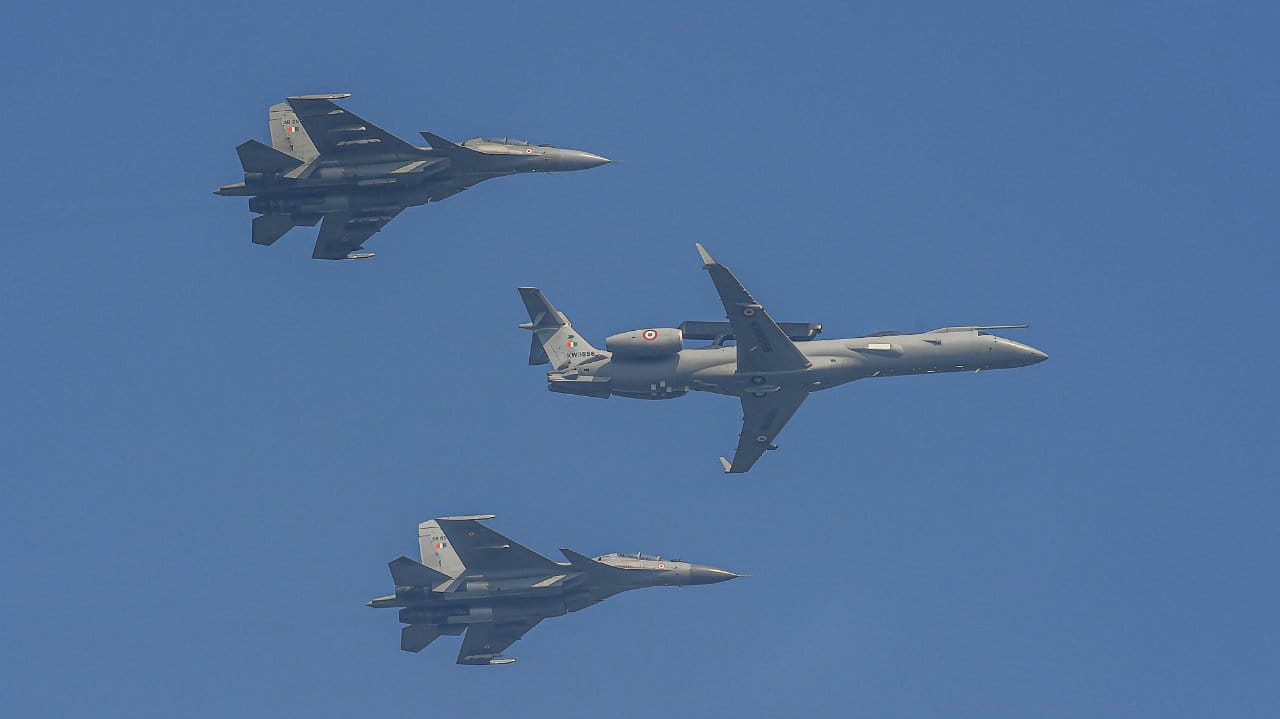 Indian Air Force (IAF)’s 'Netra' Airborne Early Warning and Control (AEW&amp;C) aircraft flanked by two Sukhoi Su-30 MKI fly over Rajpath during the parade. (Image: PTI)