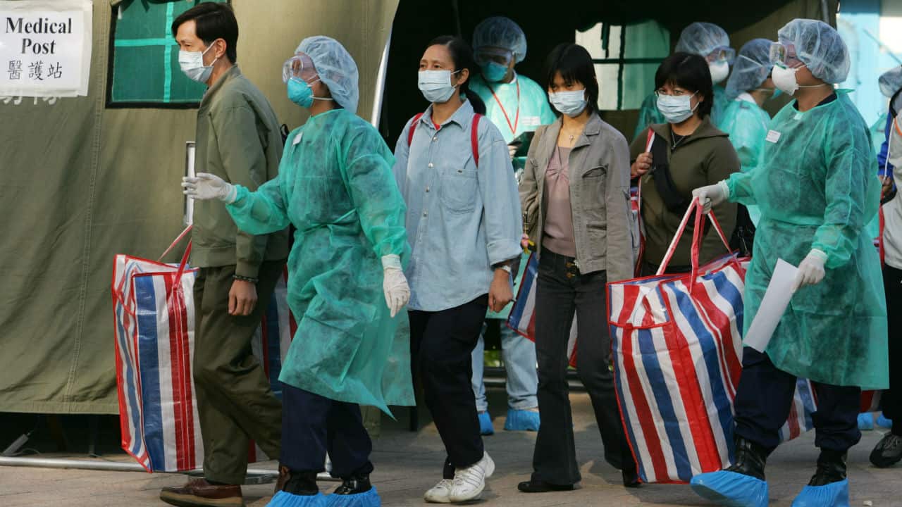 SARS outbreak of 2003| SARS or Severe Acute Respiratory Syndrome affected 26 countries and resulted in more than 8000 cases. The disease appeared in November 2002 in the Guangdong province of southern China. Other countries/areas in which chains of human-to-human transmission occurred after early importation of cases were Toronto in Canada, Hong Kong Special Administrative Region of China, Chinese Taipei, Singapore, and Hanoi in Vietnam. Symptoms of SARS are Cough (initially dry), shortness of breath, and diarrhoea are present in the first and/or second week of illness. Severe cases often evolve rapidly, progressing to respiratory distress and requiring intensive care. (Image: Reuters)