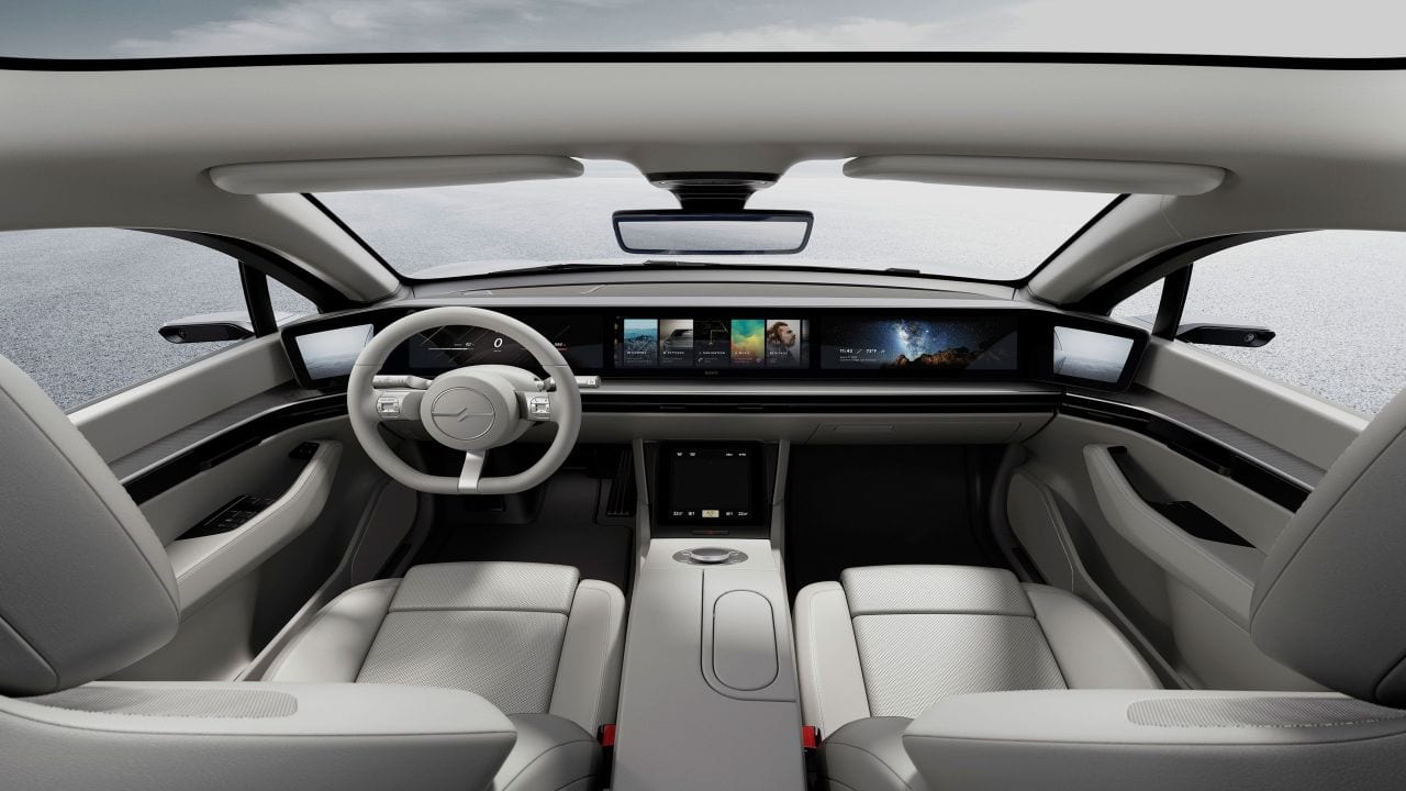Sony has equipped the interiors with a panoramic screen on the dashboard. It spans the entire width of the car and is divided into sections. It has a touchscreen infotainment system in the centre, flanked by a driver’s instrument display on one side and a passenger infotainment screen on the other. The two screens at the corners display the feed from the wing mirror cameras. (Image source: Sony)