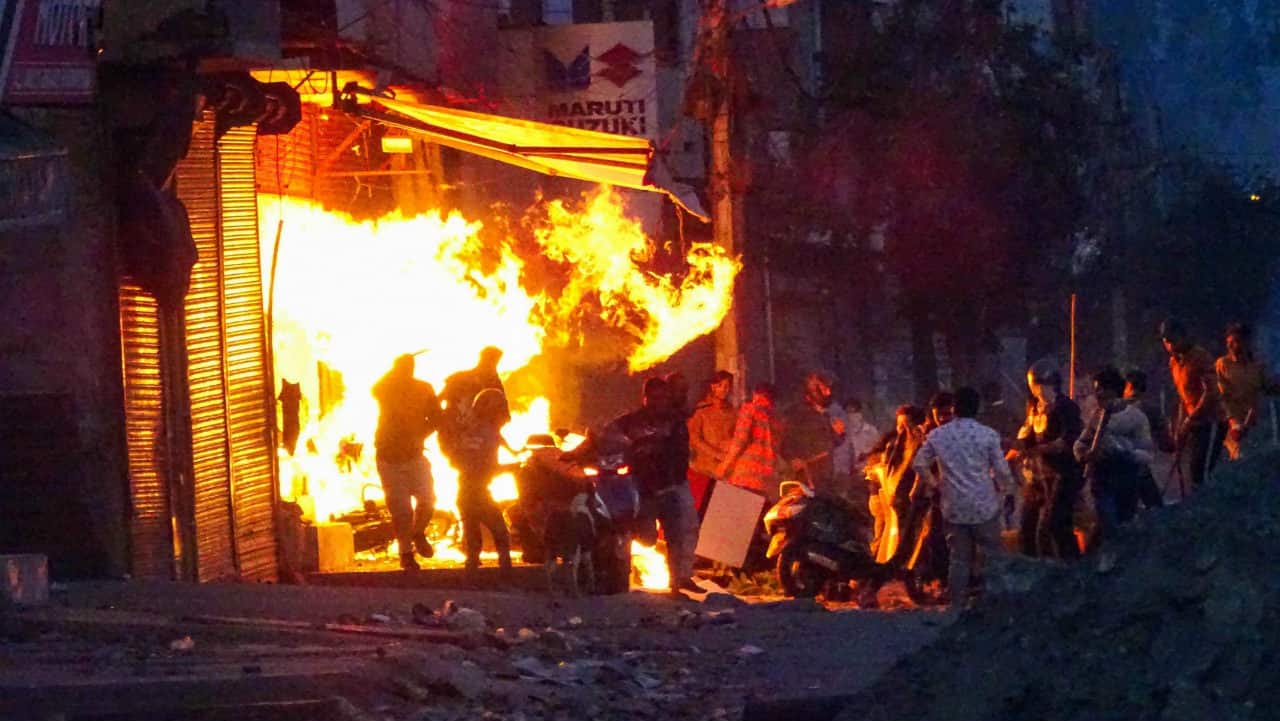 Rioters set ablaze a shop during clashes between those against and those supporting the Citizenship Amendment Act in at Gokalpuri in north east Delhi on Feb 25, 2020 (PTI)