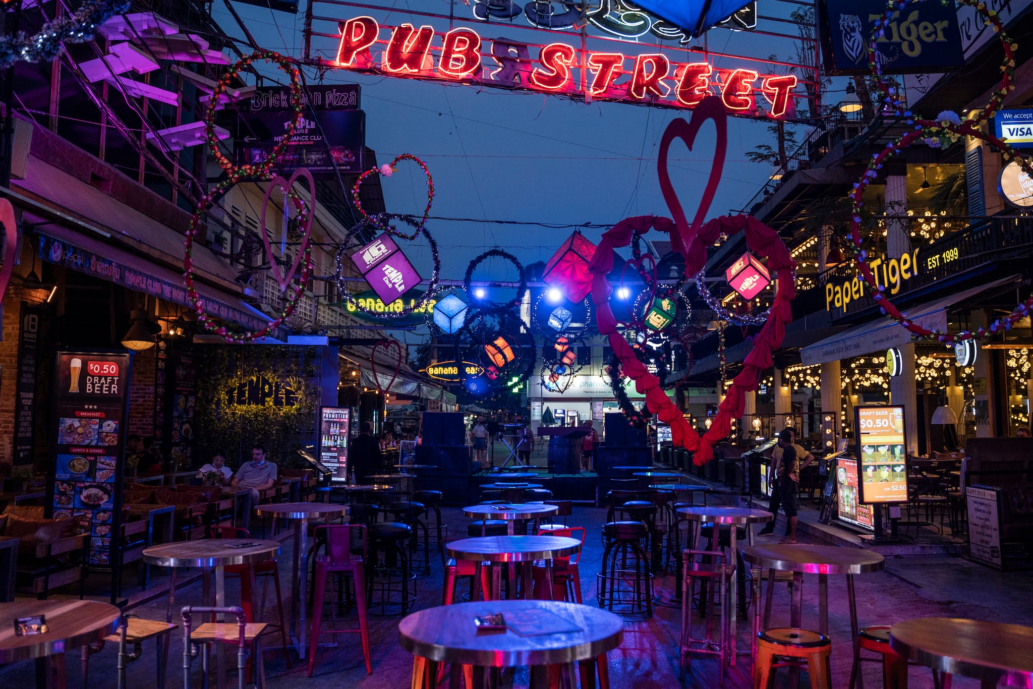 Empty bar tables on Bangkok's Pub Street usually teeming with tourists visiting Angkor Wat, March 18, 2020. (Adam Dean/The New York Times)