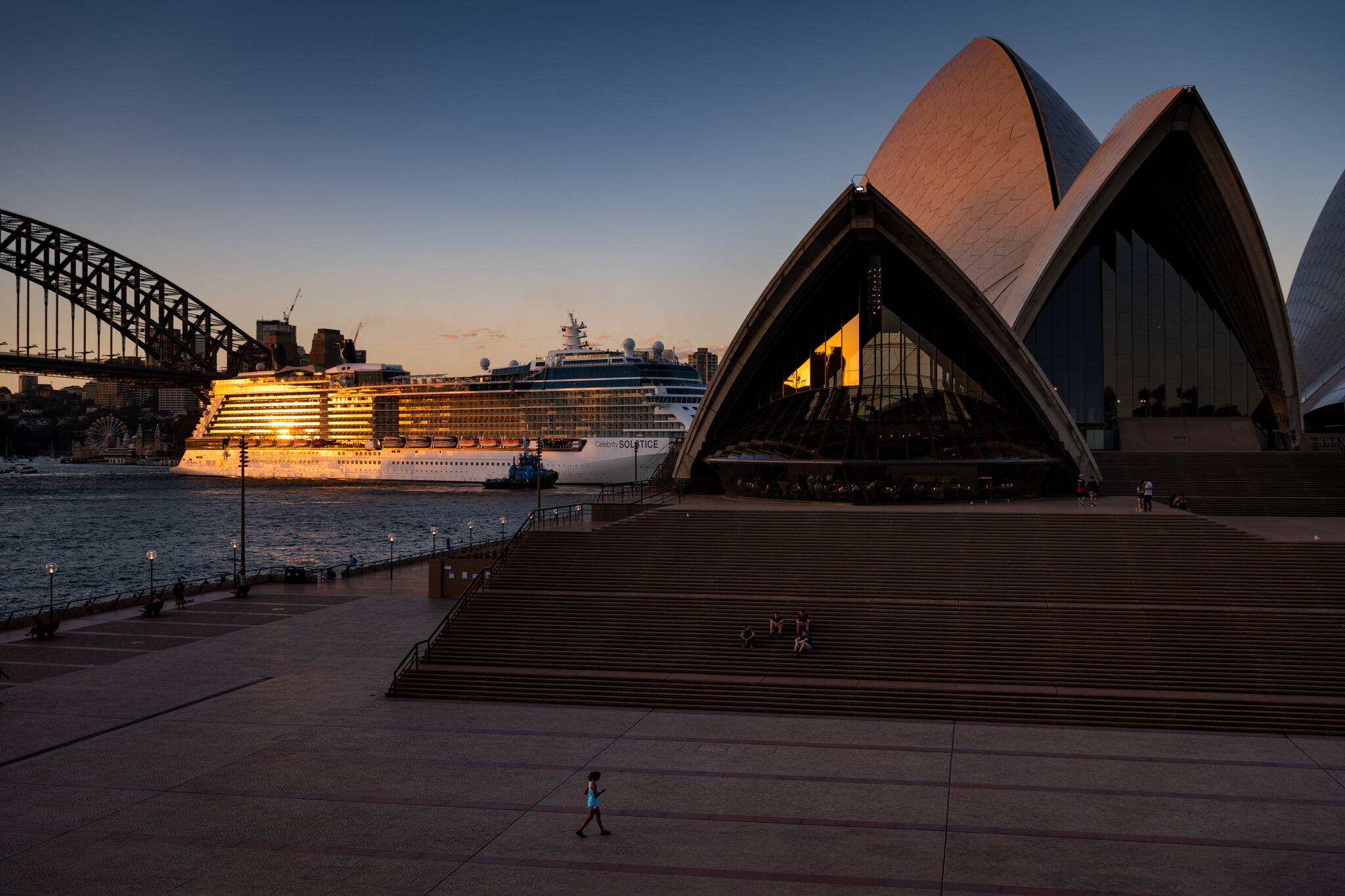 The Sydney Opera house at sunset, a time when tourists usually flock for photos, seen March 20, 2020.(Matthew Abbott/The New York Times)