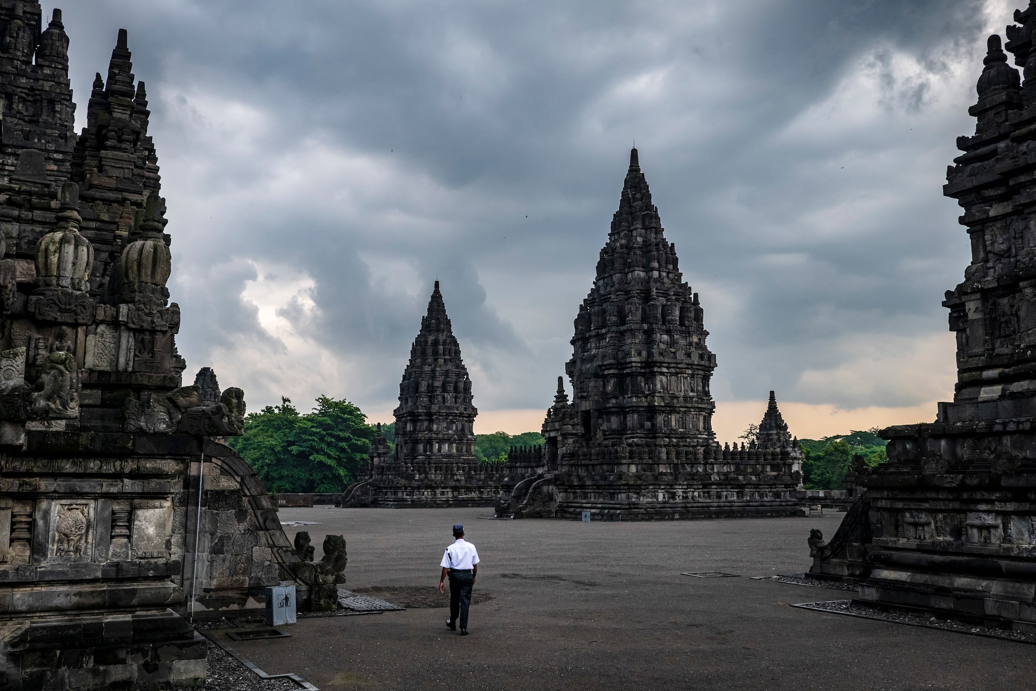 A security guard walks through the empty Prambanan temple complex March 20, 2020. (Ulet Ifansasti /The New York Times)