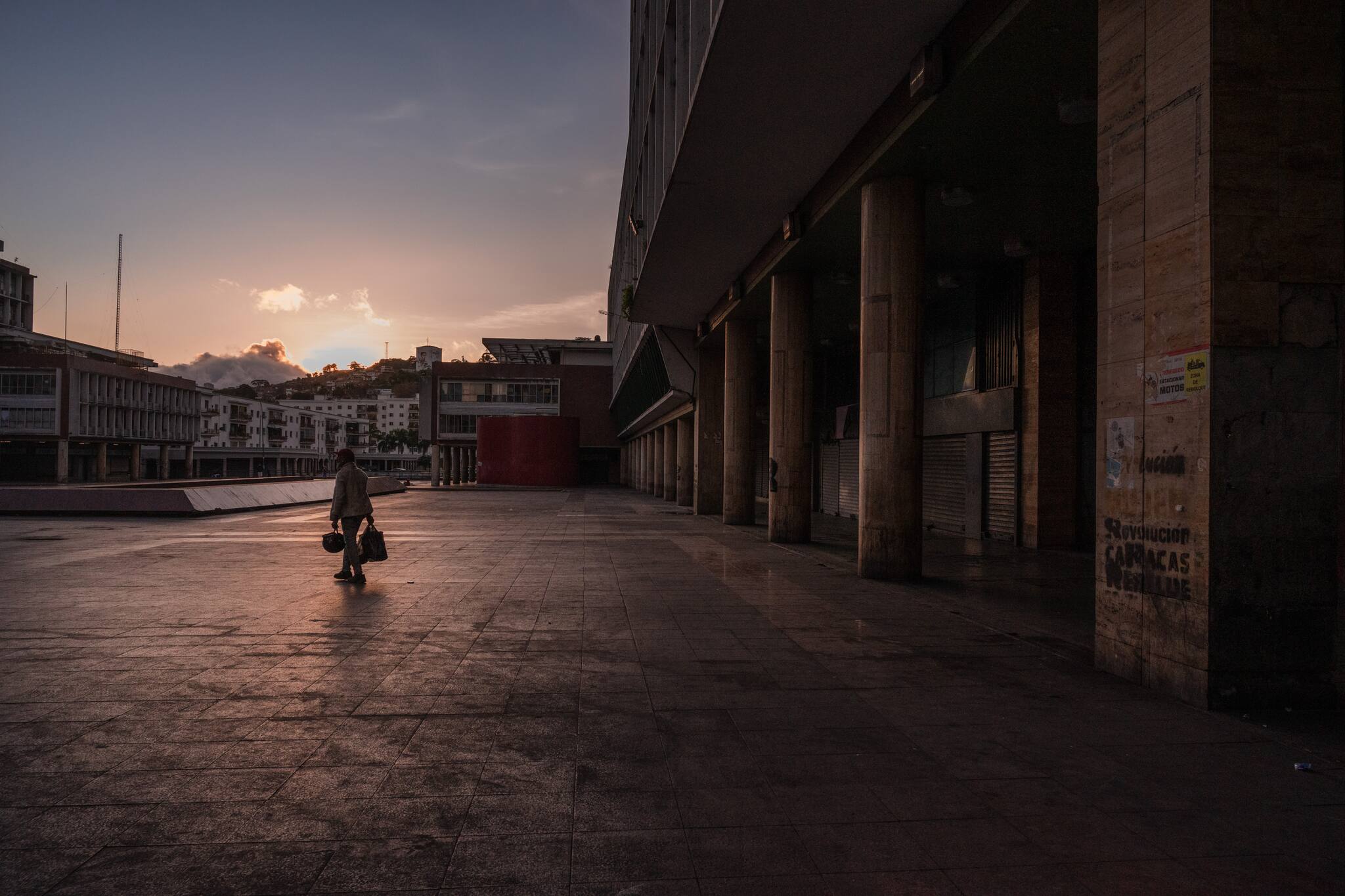 A man walks in a popular square in downtown Caracas, March 17, 2020. (Adriana Loureiro Fernandez/The New York Times)