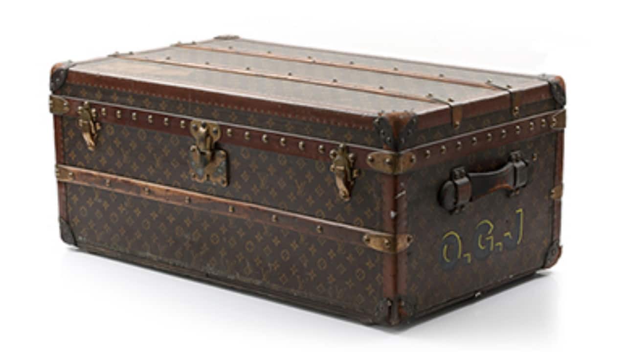 LOUIS VUITTON Sold for Rs 8.62 lakh Louis Vuitton is one of the world's leading international fashion houses started stackable rectangular-shaped trunks with the signature patented Monogram Canvas - designed as a graphic pattern of quatrefoils, flowers and the LV monogram.