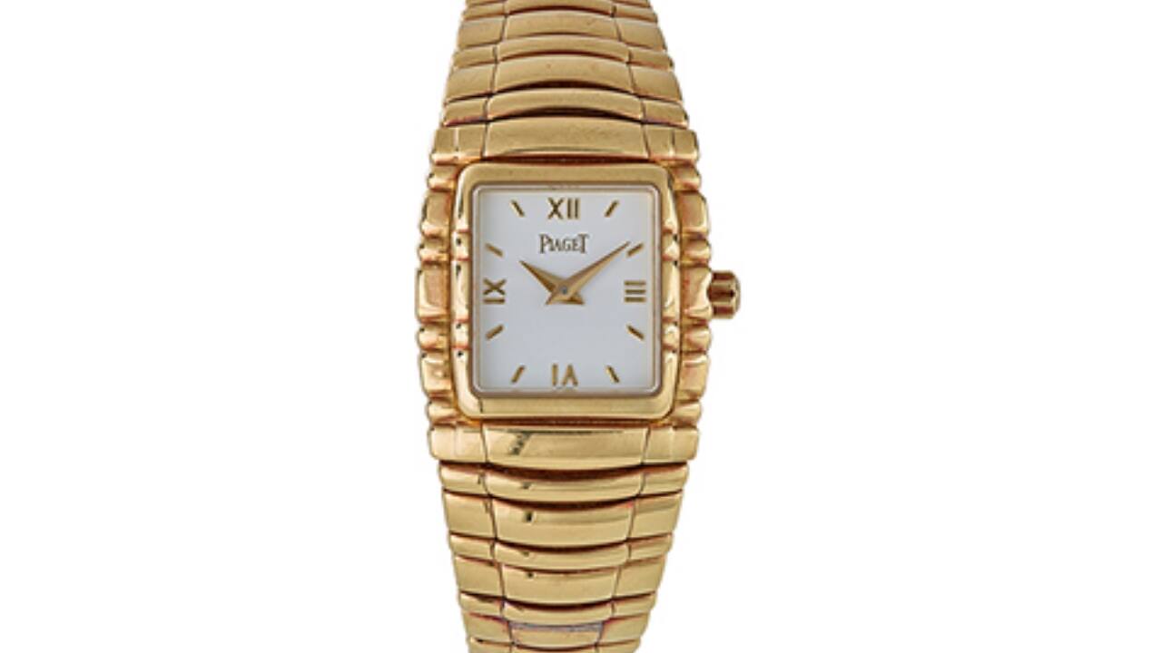 PIAGET: &#96;TANAGRA&#96; GOLD WRISTWATCH Sold for Rs 4.7 lakh An 18K yellow gold wristwatch with a white-face Roman and stick dial, dauphine hands, a calibre 620P quartz movement with 6 jewels, a flexible gold watch bracelet.