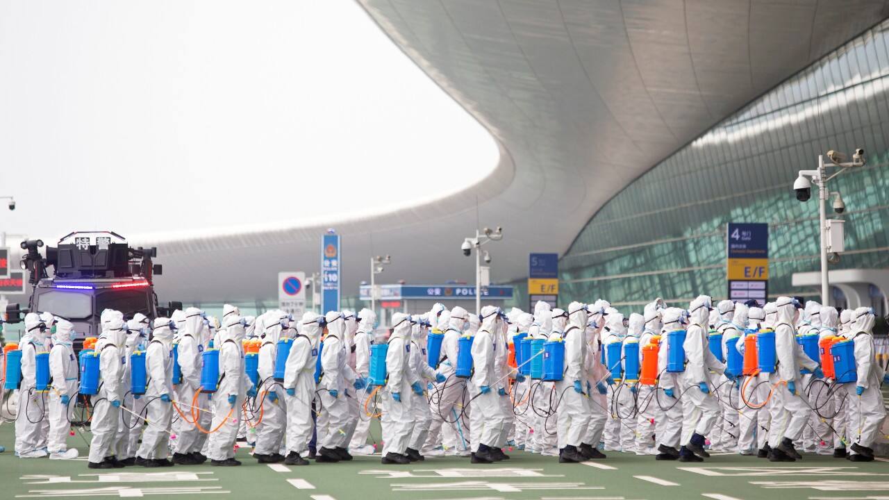 Firefighters in protective suits are seen during an operation to disinfect Wuhan Tianhe International Airport before the airport resumes its domestic flights on April 8, in Wuhan, Hubei province. (Image: Reuters) Firefighters in protective suits are seen during an operation to disinfect Wuhan Tianhe International Airport before the airport resumes its domestic flights on April 8, in Wuhan, Hubei province. (Image: Reuters)