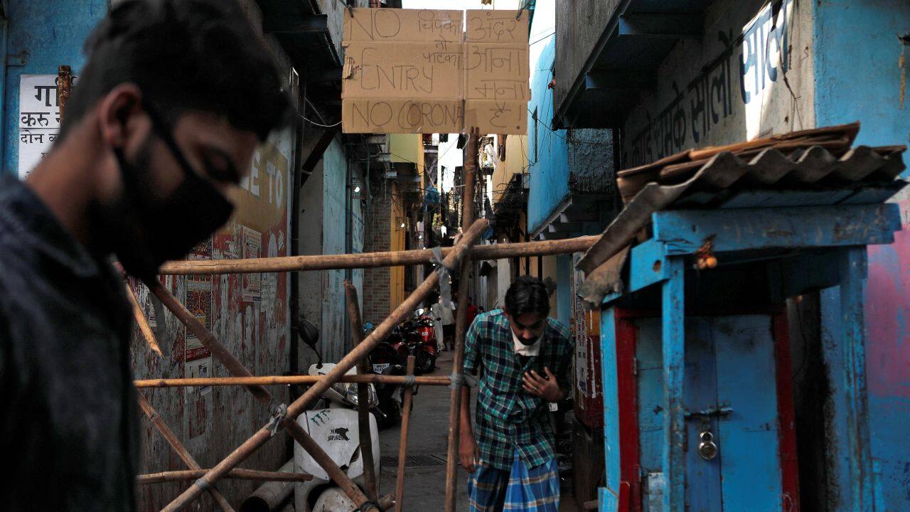 Some residents have barricaded alleyways using carts, bicycles and sticks. Signs warn outsiders to keep away. (Reuters)
